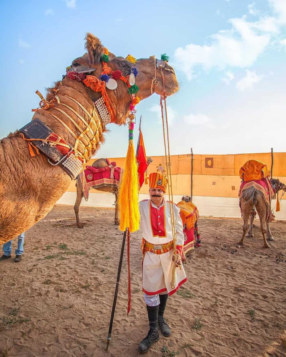 man standing under camels head 2 Month India Itinerary 