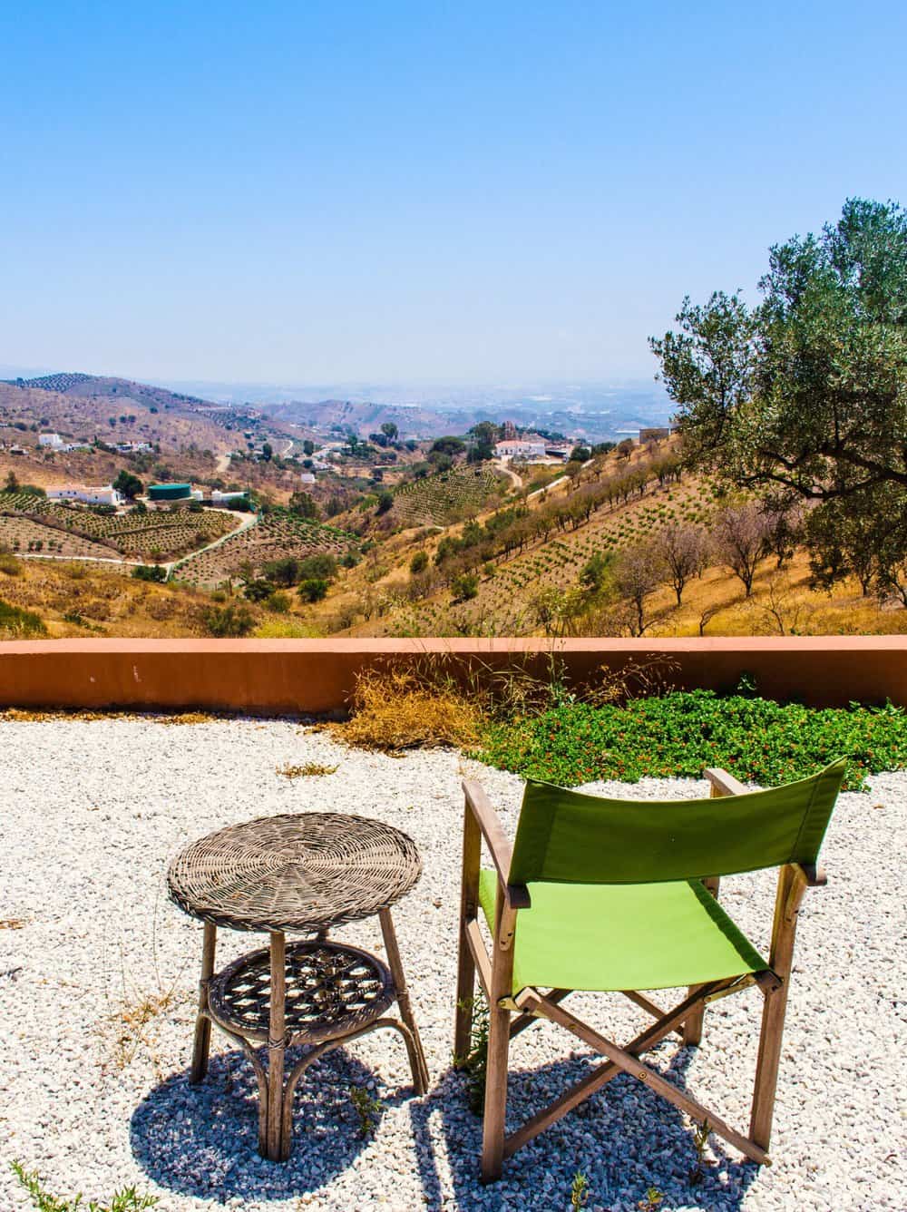 Slow living lifestyle in spain. A chair gazes out over a vast and beauitful view. A perfect spot to do nothing in.