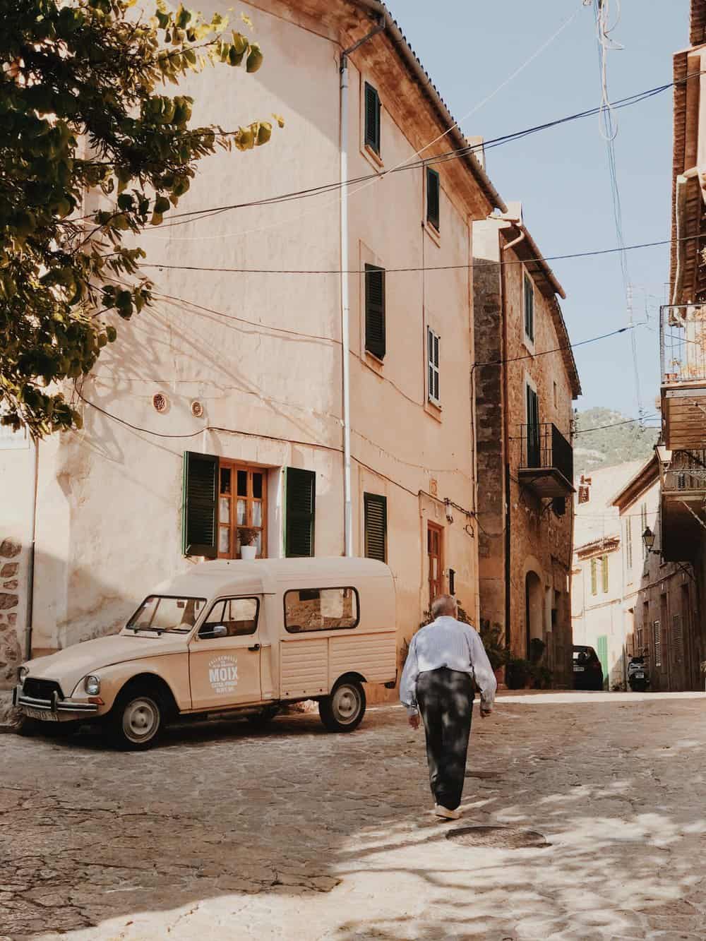 An older man roams the quiet streets of spain.Living a slow pace of life. 