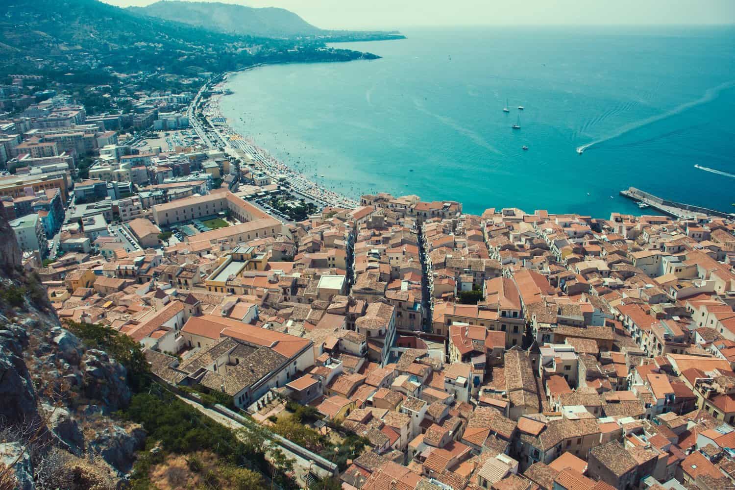 drone shot of the city of cefalu in sicily italy