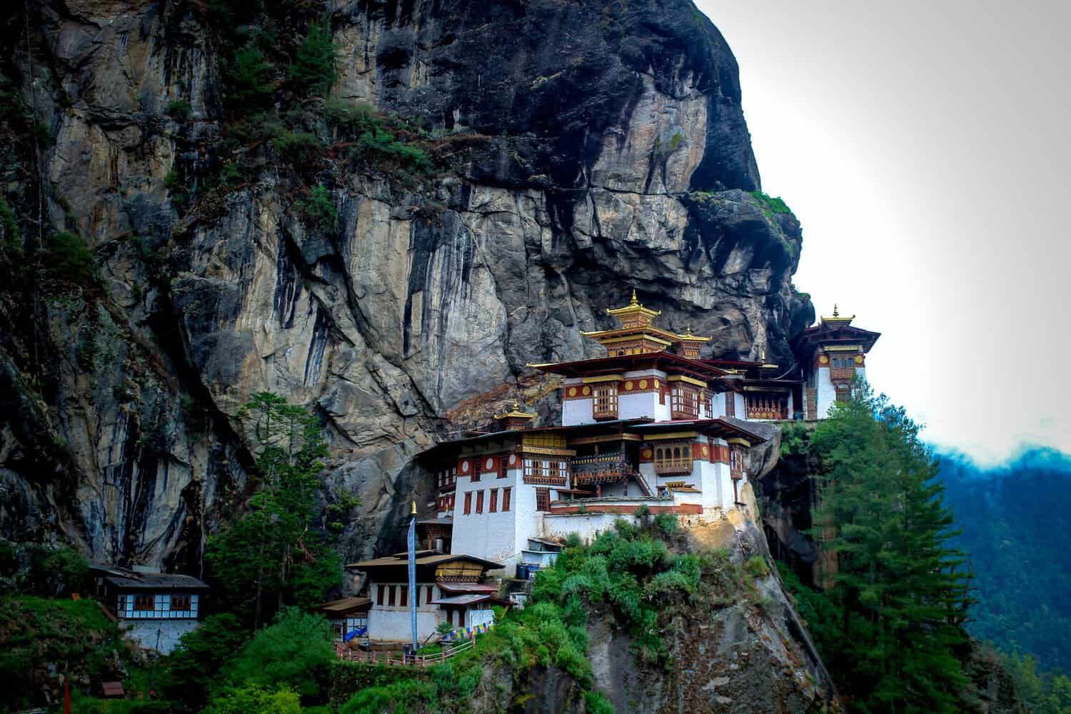 paro taktsang in bhutan a mountian top monestry nestled into the cliffs of a jaw dropping mountain range