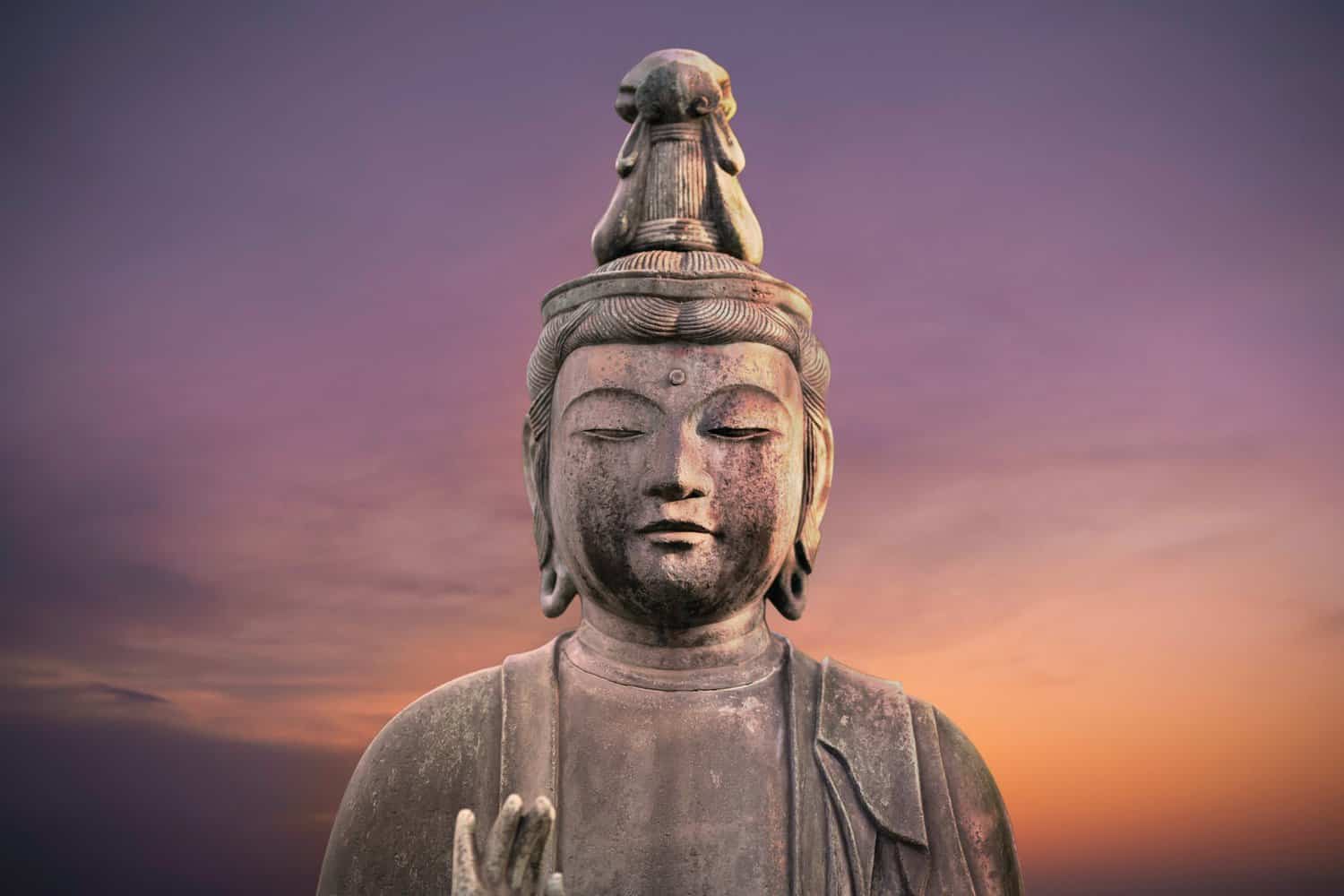 buddha statue during golden hour,sacred meaning