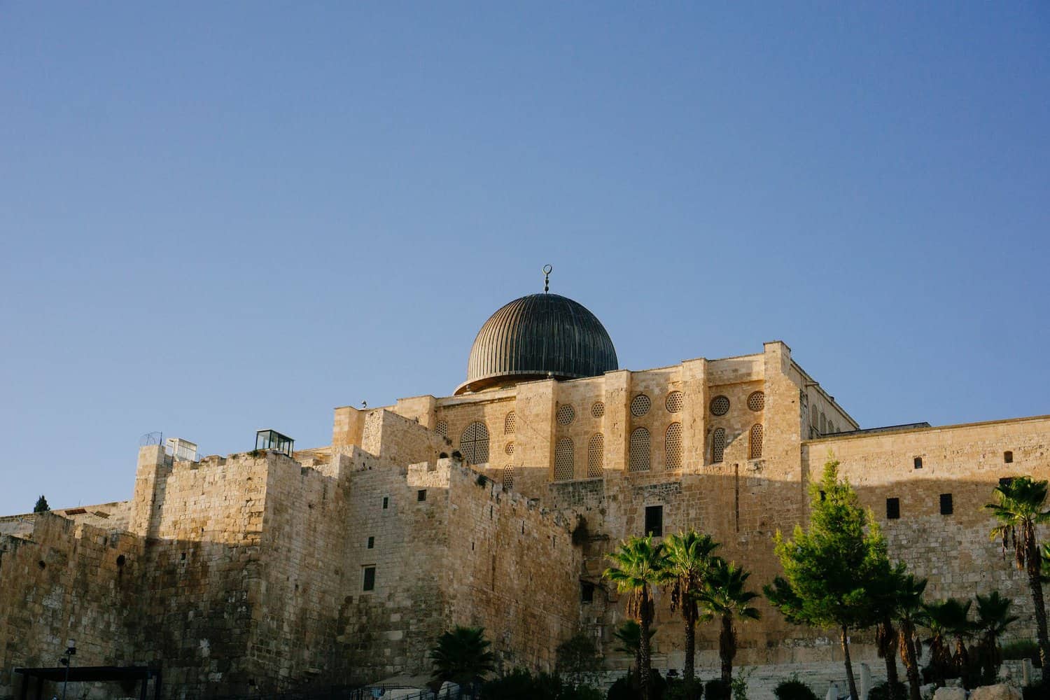 bibilcal site of jerusalem, beige coloured walled mosque with blue dome