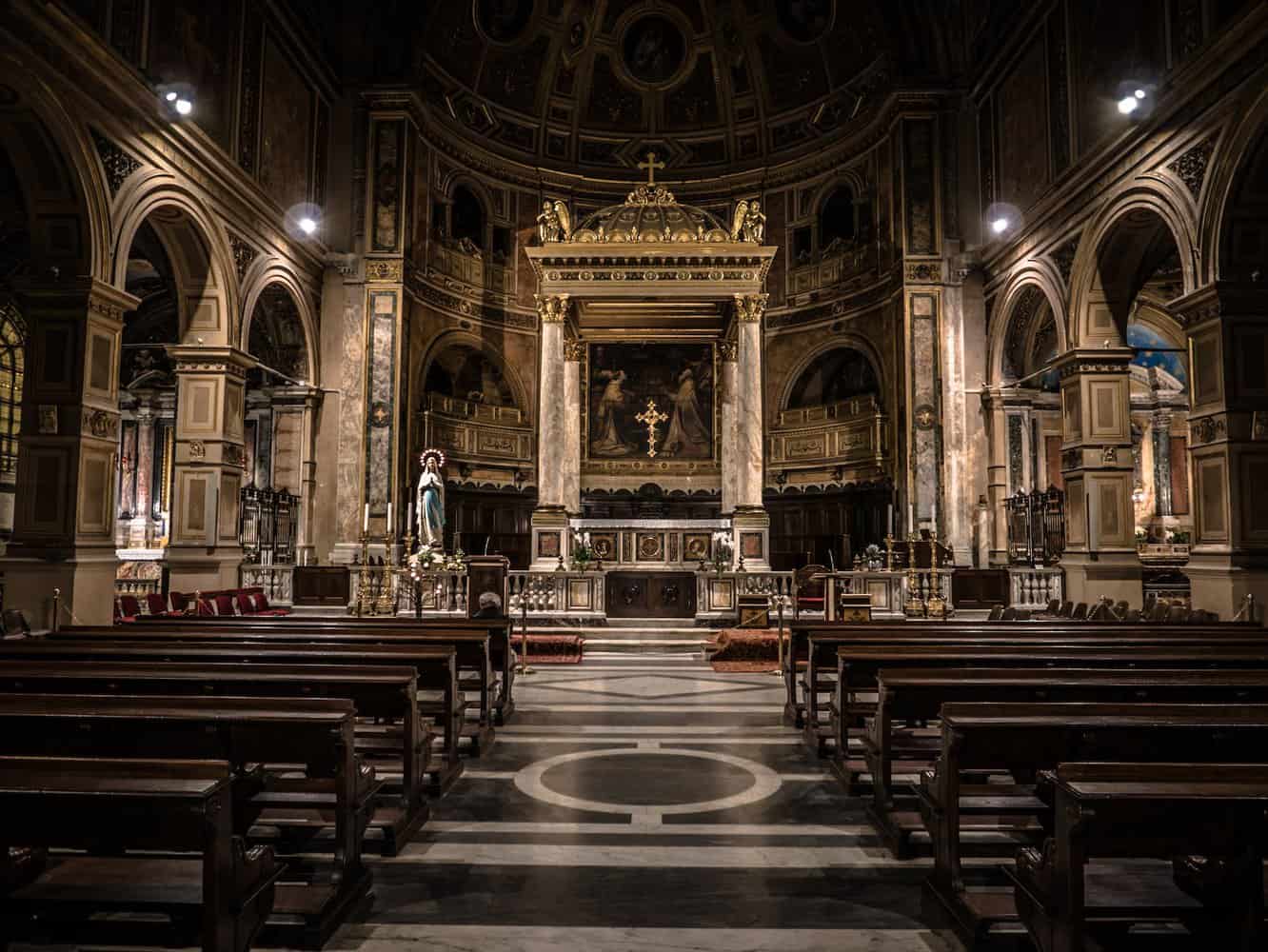 cathedral interior religious with benches empty in back