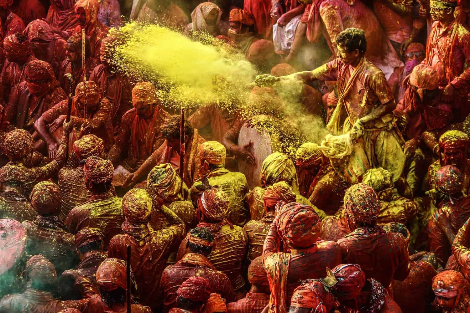 crowd of people covered in paint holi is a sacred festival in india 