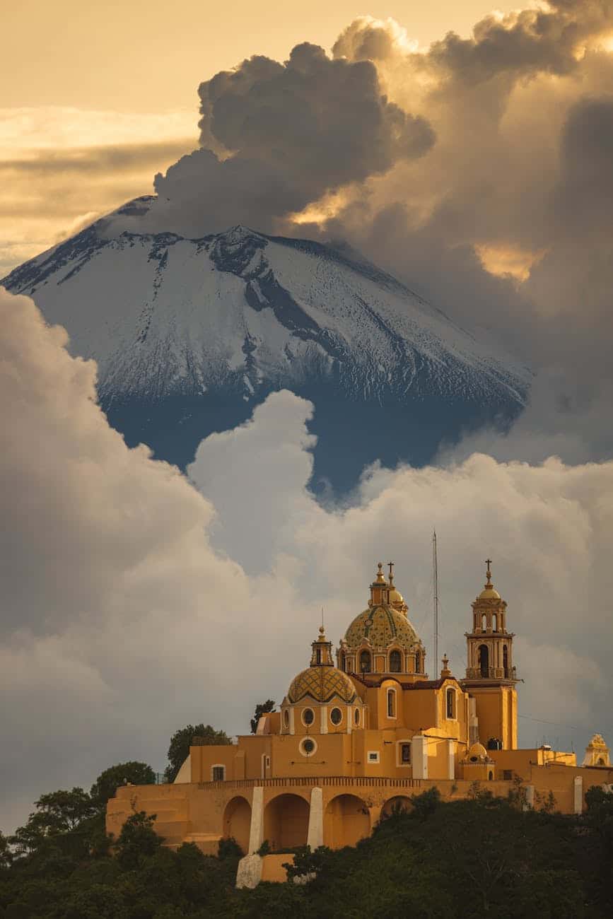 church with majestic volcano in background